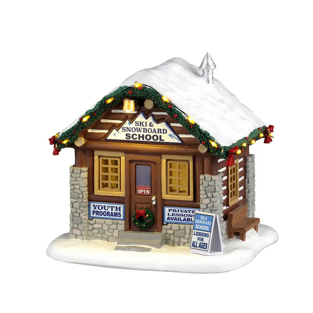 Lemax Ski & Snowboard School Christmas Village table accent featuring miniature skiers and snowboarders in a festive village scene.