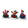 Set of three Lemax Snow Tubers Christmas village figurines featuring festive characters in winter attire.
