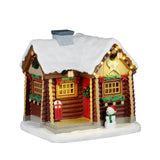Lemax Snowshoe Cabin Christmas Village table accent featuring a cozy snow-covered cabin with snowshoes in front.