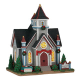 Lemax Spruce Valley Church illuminated building from Christmas village display, featuring a detailed church scene with festive lights.