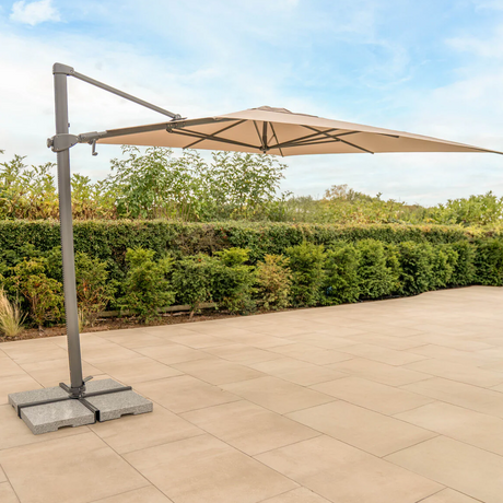 Kettler Luna 3x3M square cantilever parasol with stone canopy, granite base, and night cover for outdoor furniture.