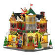 Lemax Tidings and Joy illuminated Christmas village building with festive holiday details and lights.