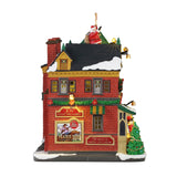 Lemax Tidings And Joy B/O illuminated Christmas village building with festive holiday decorations and glowing windows.