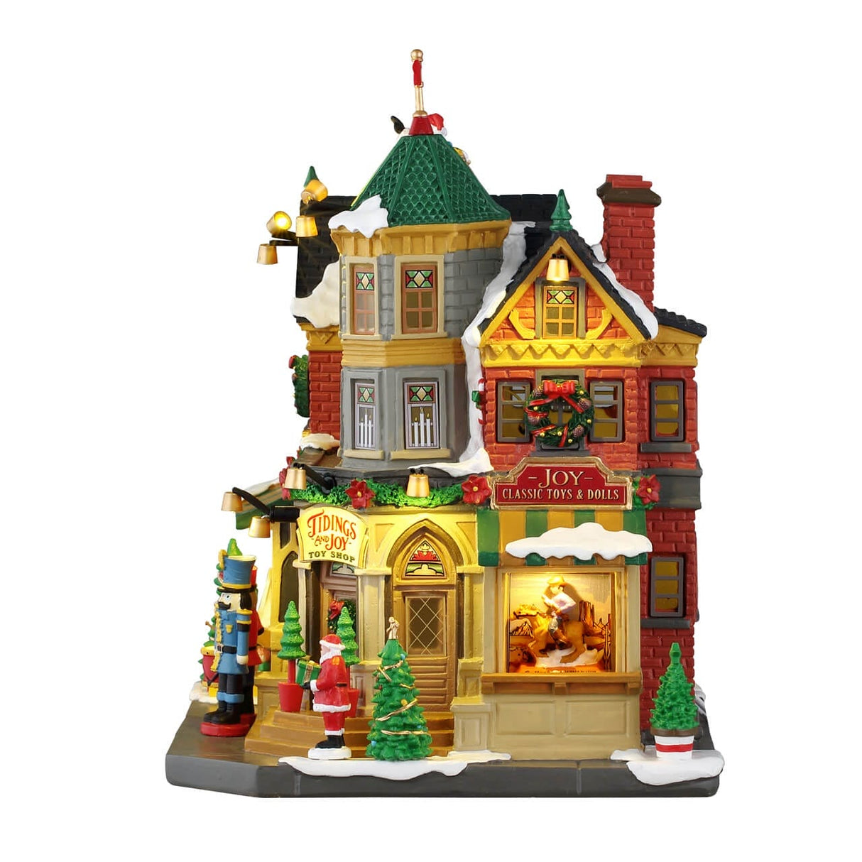 Lemax illuminated Christmas village building titled "Tidings And Joy" with festive holiday decor and warm lighting.
