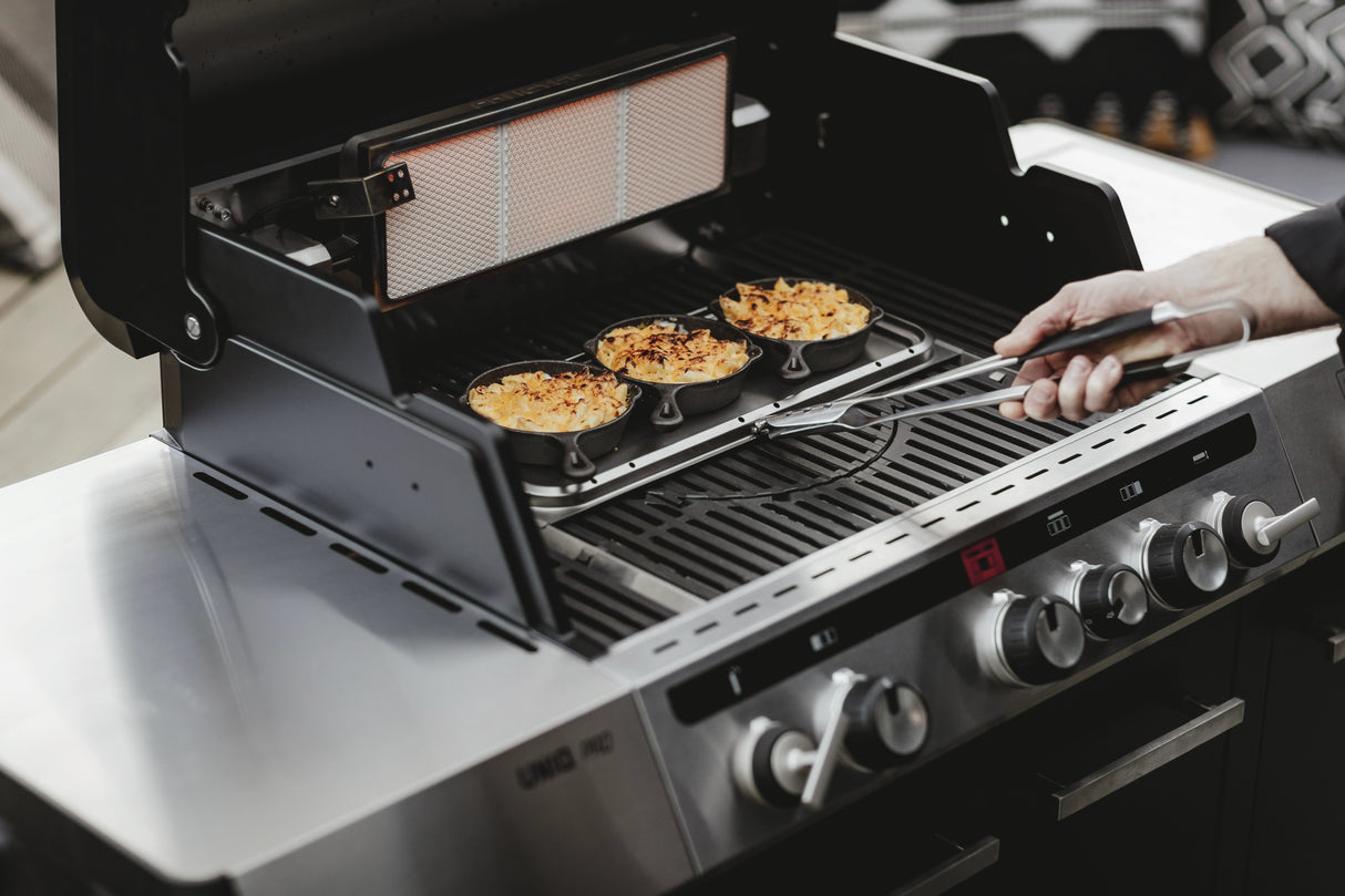 Enders UNIQ PRO 3 IK Turbo Gas BBQ with cover, featuring stainless steel grilling surface and control knobs for outdoor cooking.