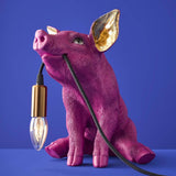 Werner Vob WERNS Piggy Pig magenta indoor table lamp with quirky pig design for home lighting decor.