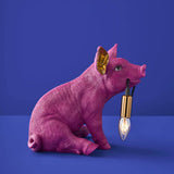 Werner Vob WERNS Piggy Pig magenta table lamp with a playful pig design, ideal for quirky indoor lighting decor.