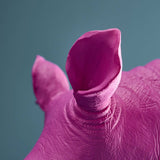 Werner Vob WERNS rhinoceros bookends set in magenta and gold, decorative indoor ornaments for books or home decor.