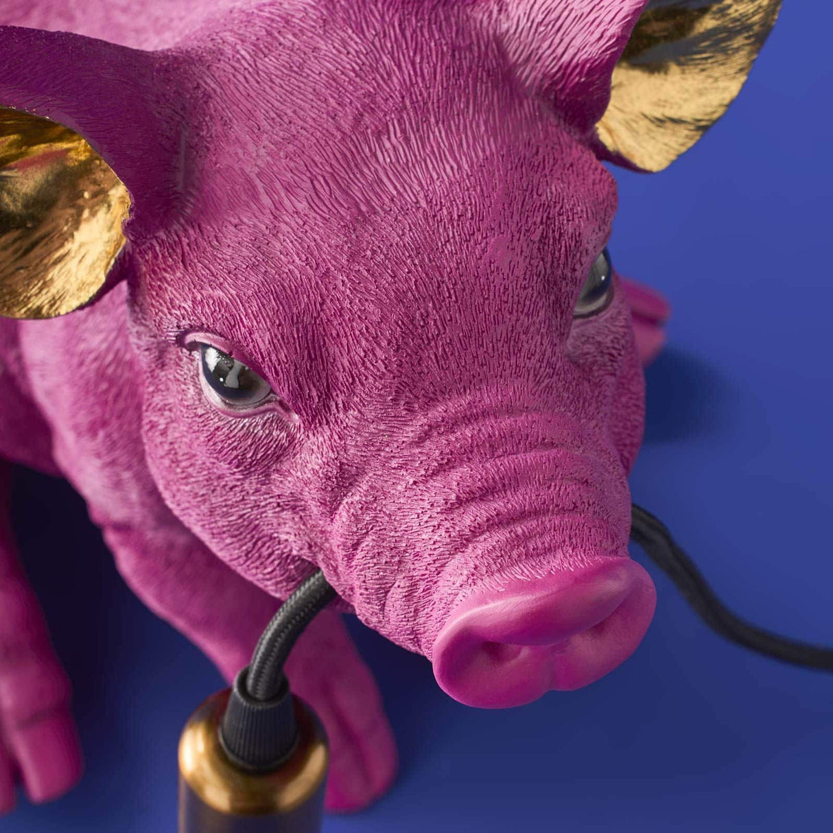 Magenta WERNS® Piggy Pig table lamp by Werner Vob, featuring a whimsical pig design for indoor home lighting.