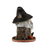 Lemax Spooky Town witch's skull hut table accent with spooky architectural details, perfect for Halloween village displays.