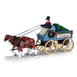 Lemax Christmas Is Coming village table accent featuring festive holiday scene and detailed miniature Christmas decorations.