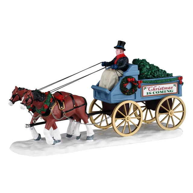 Lemax Christmas Is Coming village table accent featuring festive holiday scene and detailed miniature Christmas decorations.