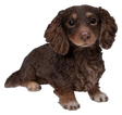 Long-haired chocolate and cream Dachshund resin ornament by Vivid Arts, detailed dachshund figure with a realistic appearance.