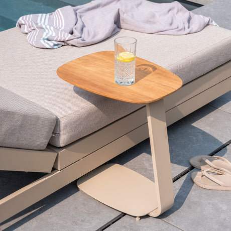 4 Seasons Outdoor Gentle Support Teak Latte table with metal frame, showcasing modern outdoor furniture design.