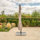 Kettler Luna 3x3M square cantilever parasol with meadow green canopy, granite base, and night cover for outdoor furniture.