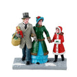 Lemax Christmas Village figurine depicting a festive Christmas Eve shopping scene with detailed holiday figures.