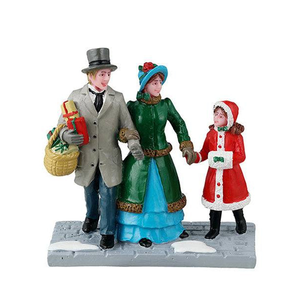 Lemax Christmas Village figurine depicting a festive Christmas Eve shopping scene with detailed holiday figures.