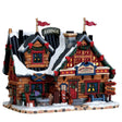 Lemax Christmas Village Apres Ski Lodge illuminated building with festive holiday details and snow-covered roof.
