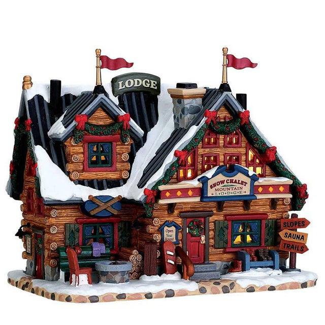 Lemax Christmas Village Apres Ski Lodge illuminated building with festive holiday details and snow-covered roof.