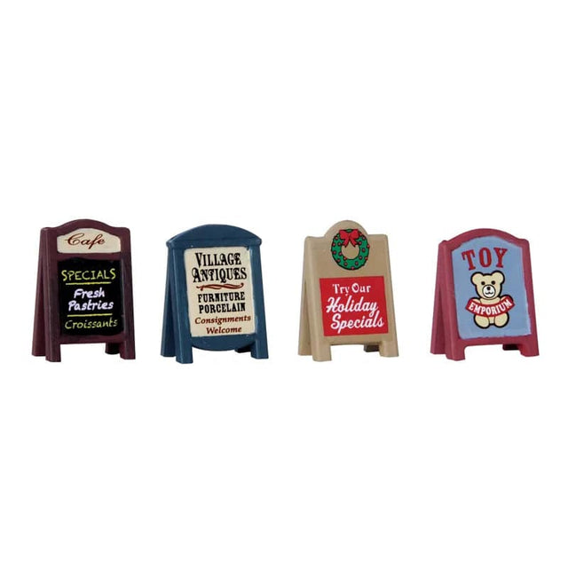 Lemax Christmas Village accessory featuring colorful village signs with festive holiday decorations and lettering.