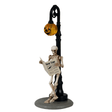 Lemax Spooky Town figurine titled Checking His Horoscope, featuring a spooky character examining a crystal ball in Halloween-themed setting