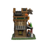 Silver Slug Saloon illuminated building from Lemax Spooky Town, featuring spooky town details and glowing lights.