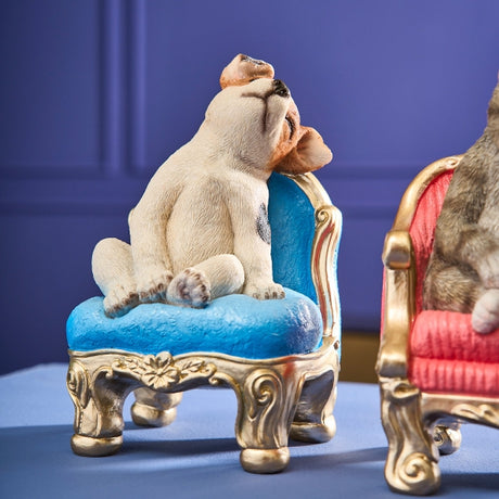 Werner Voß dog ornament sitting on a blue armchair, 20cm luxury German designer figurine for home décor.