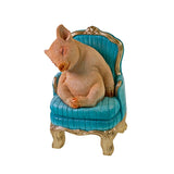 Werner Voß Snoozing Piglet ornament on armchair, 20cm, luxury German designer figurine for home decor.