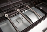 Atom Grills Xenon 3.1 gas BBQ with stainless steel lid, side shelves, and multiple burners for outdoor grilling.
