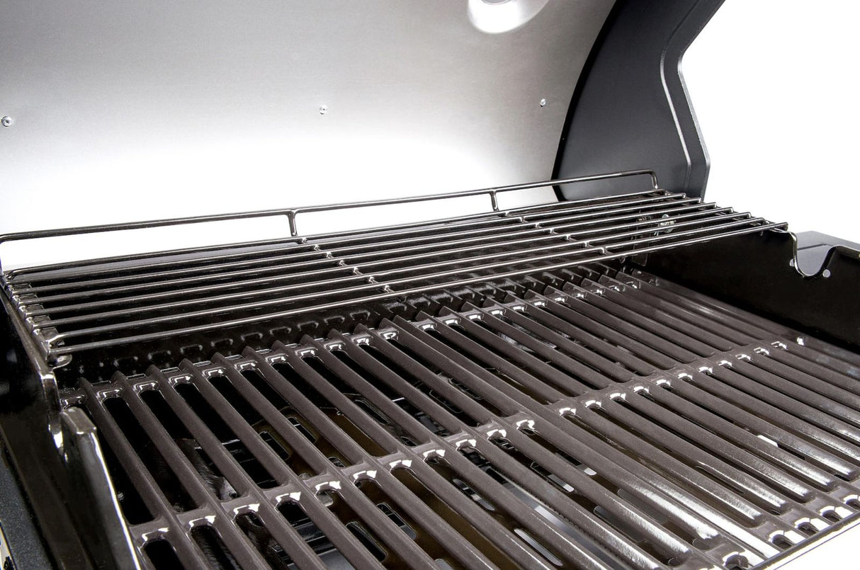 Atom Grills Xenon 3.1 Gas BBQ showing stainless steel lid, control knobs, and cooking grates in a backyard setting