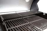 Atom Grills Xenon 3.1 Gas BBQ showing stainless steel lid, control knobs, and cooking grates in a backyard setting